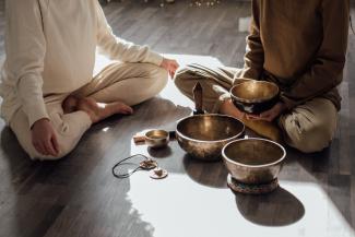 Photo of two people meditating together
